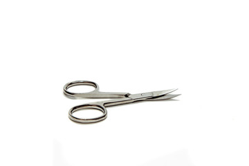 Nail scissors on a white background. Nail scissors isolated on a white background. Concept of cleaning and sawing nails and nail clippers.