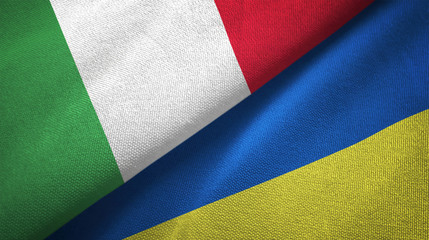 Italy and Ukraine two flags textile cloth, fabric texture