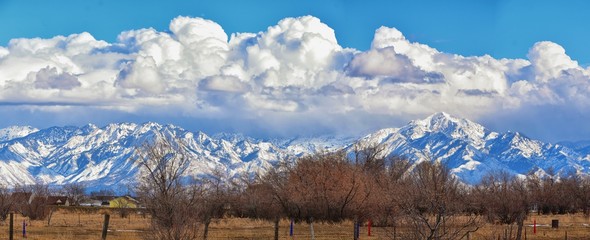 Winter Panoramic view of Snow capped Wasatch Front Rocky Mountains, Great Salt Lake Valley and...