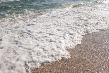Seashore and the beach and the sea on a sunny spring day.