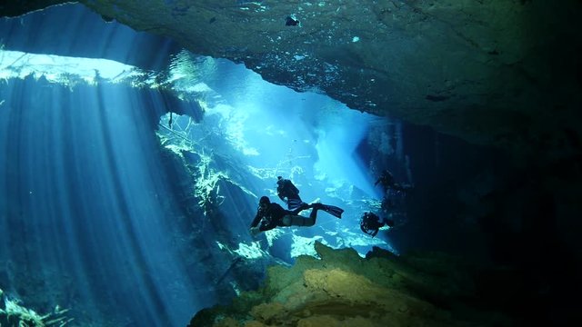 scuba diver exploring a cave