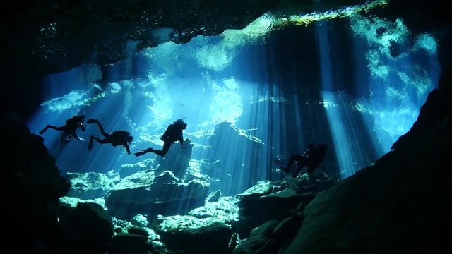 scuba diver exploring a cave
