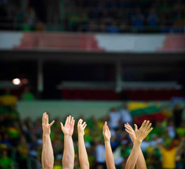 fans clapping on the podium of the stadium
