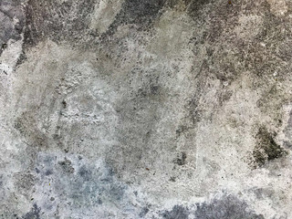 Damaged old concrete on the dirty floor