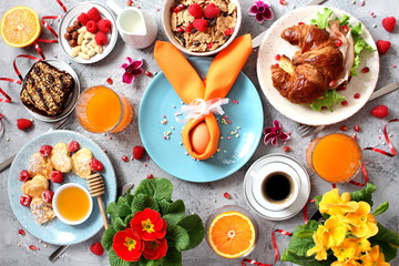 Breakfast food table. Festive brunch set, meal variety with pancakes, croissant, juice, fresh...