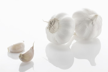 Fresh garlic closeup on a white background.