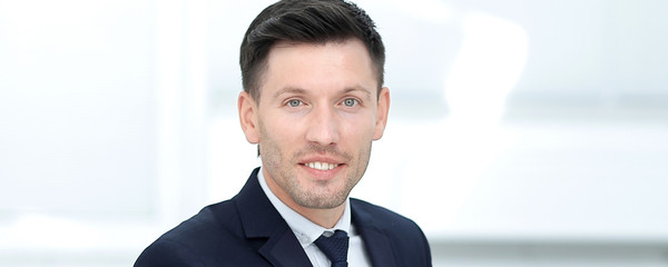 close up.businessman running uses laptop to check financial statistics