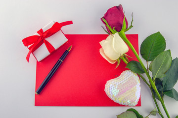 Obraz na płótnie Canvas International Women's Day, March 8. Red white cards with pen and decorative items, roses, hearts, chocolates, gift box on a white background.