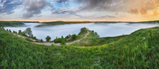 Spring fog over the river canyon. scenic dawn