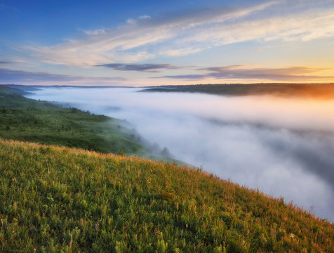 Spring fog over the river canyon. scenic dawn