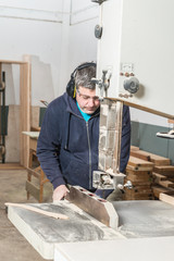 Male carpenter working in his carpentry workshop.