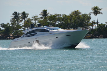 Well appointed silver cabin cruiser returning to the Port of Miami