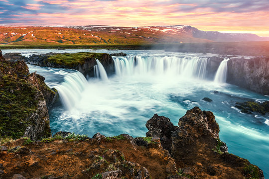 Colorful sunrise on Godafoss waterfall on Skjalfandafljot river, Iceland