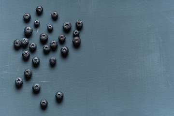 Blueberries background. Blueberry border design. Ripe and juicy fresh picked bilberries close up. Copyspace for your text