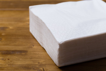 paper napkin on wooden background.
