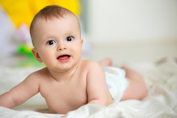 infant baby boy crawl with towel