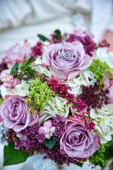 wedding bouquet with roses and rings