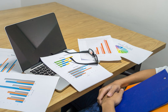 Working table with many financial document reports