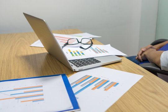 Young businessman feel tired with financial number on document report