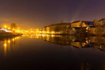 Fototapeta na wymiar Night winter royal medieval Town Pisek above the river Otava, Czech Republic 