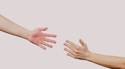 Help and help each other, reaching out for a helping hand. The hand is trying to grab the other...