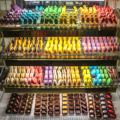 An assortment of colorful macaroons and chocolates.