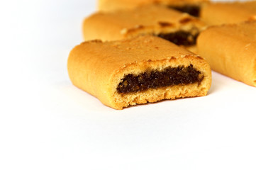 Close up of fig bar cookies on white background with copy space, not isolated.