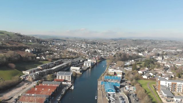 Aerial drone shot of river leading to British town of Totnes