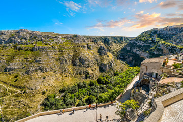 Fototapeta na wymiar The steep cliffs, caves, sassi and canyons of the ancient city of Matera, Italy, taken from the Madonna de Idris church in the Basilicata region.