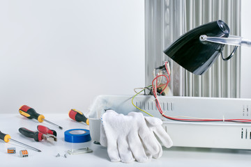 Different electrical tools and equipment in the workshop with copy space. Mockup.