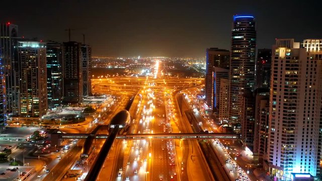 Aerial hyperlapse of a busy highway in Dubai at night, U.A.E.