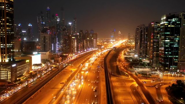 Aerial hyperlapse of a busy highway in Dubai at night, U.A.E.