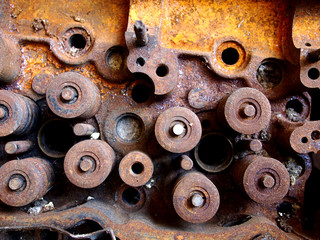 Rusty and broken car engine at a junkyard