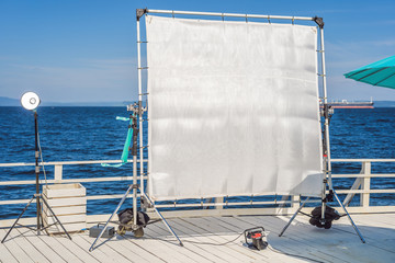 A big frame of a silk textile used for softening of the hard light on a cinema production set