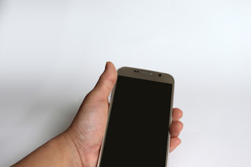 The hand holding the mobile phone.