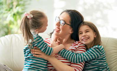 mother and daughters playing