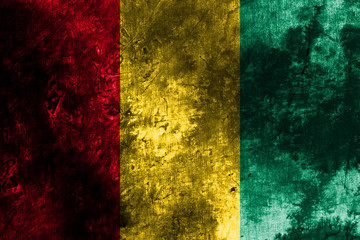 Old Guinea grunge background flag