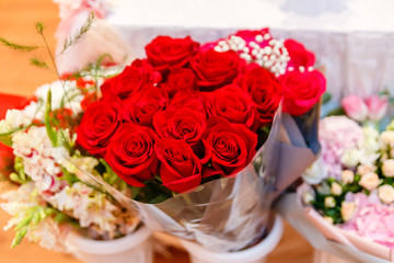a large bouquet of red roses