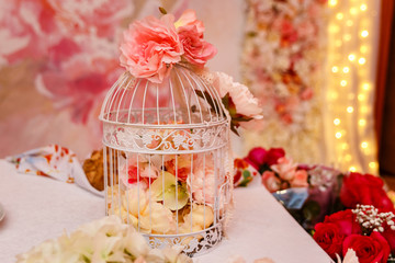 flowers in a white cage