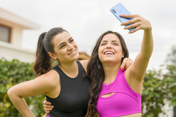 Two fitness girls taking a selfie