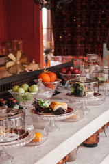 Puff pastries and fruits on pedestal tray in bakery cafe
