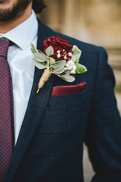 Close up of a groom with a boutonniere