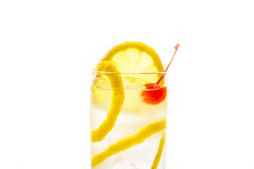 Traditional Tom collins cocktail isolated on white background. Selective focus. Shallow depth of field.