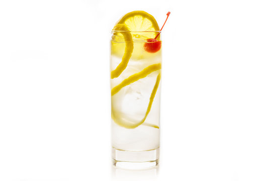 Traditional Tom collins cocktail isolated on white background. Selective focus. Shallow depth of field.