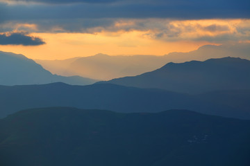 Fototapeta na wymiar Beautiful landscape of mountain range with sunrise light in dongchuan of China