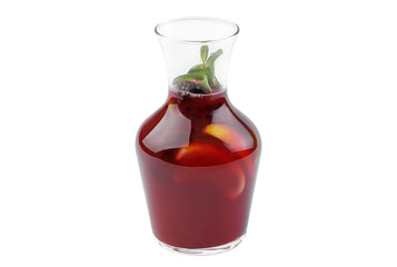 Cocktail in a glass carafe with blackberries and lime and sweet syrup. Soft drink isolated on white background.