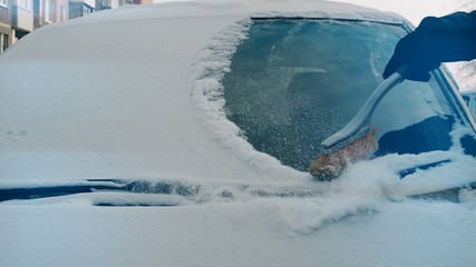 Winter. Cleaning The Car From The Snow