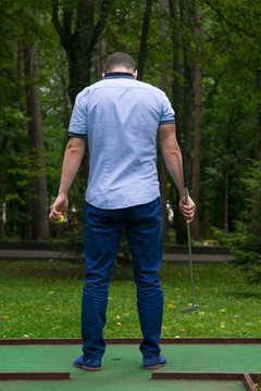 Green Mini Golf Course, Men In Blue Pants, Rear View