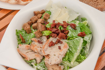 Fresh green salad and steak.