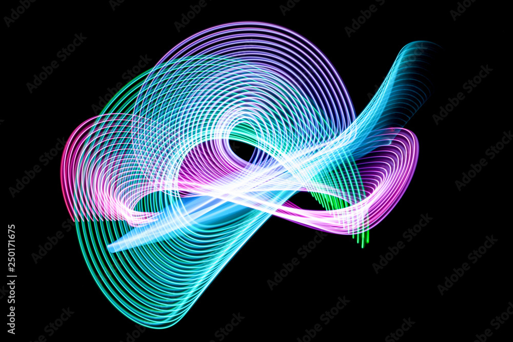 Poster abstract rainbow neon glowing crossing lines pattern. dark  background of colorful neon glowing ligh